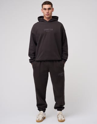 Baggy Leisure Club Cuffed Track Pants in Washed Black Detail2