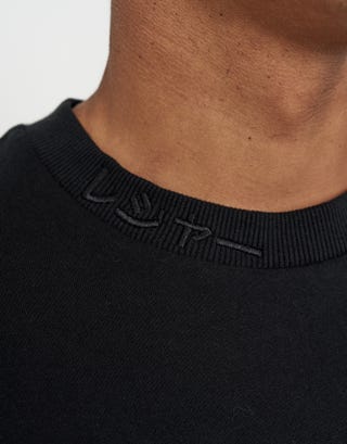 Leisure Applique Relaxed Fit T Shirt in Black Detail