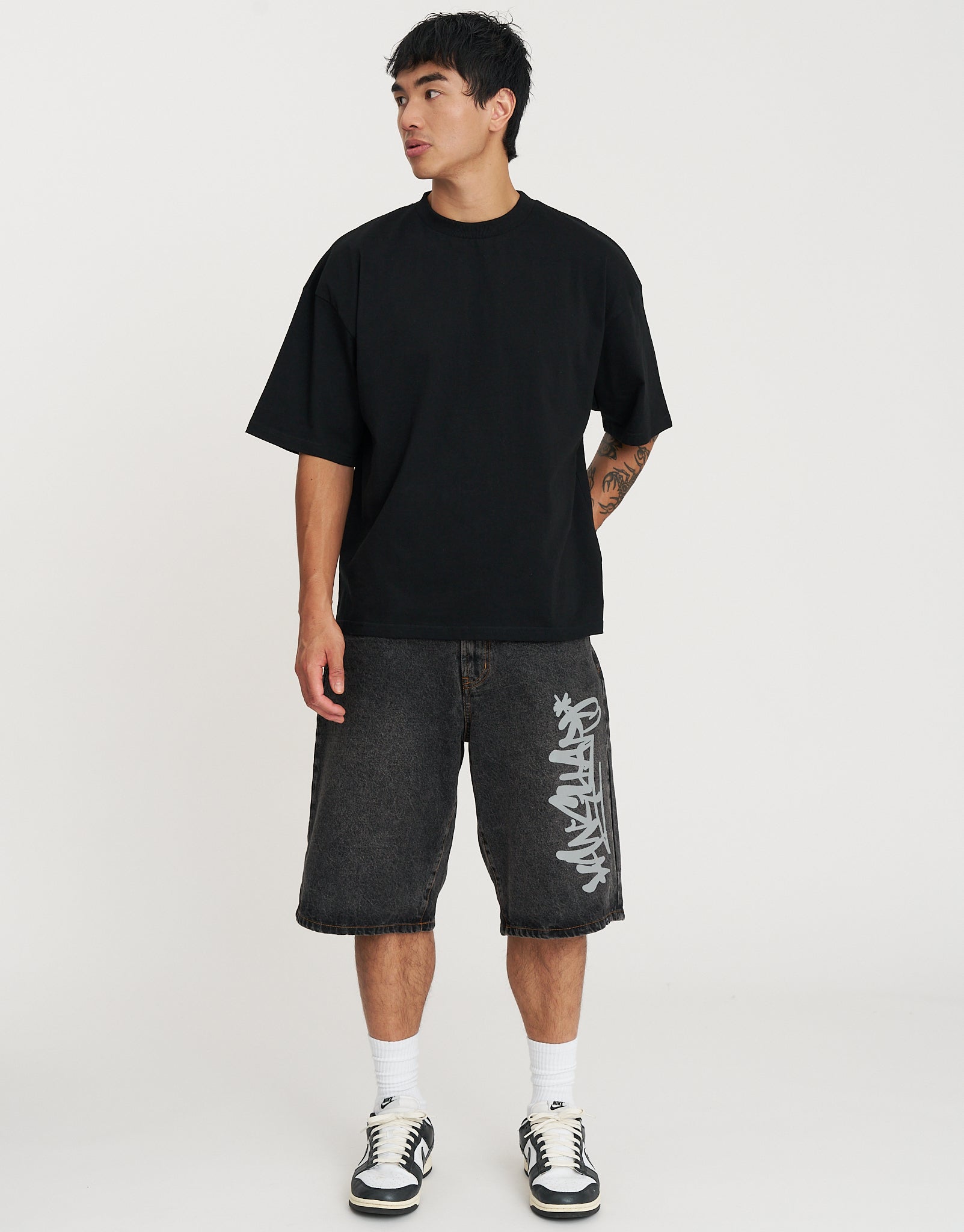 Vanguard Graffiti Baggy Fit Jorts in Acid Black | Hallensteins NZ