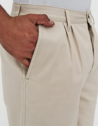 Relaxed Fit Pleated Shorts in Bone Detail